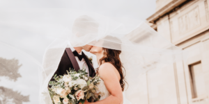 A couple kissing on their wedding day