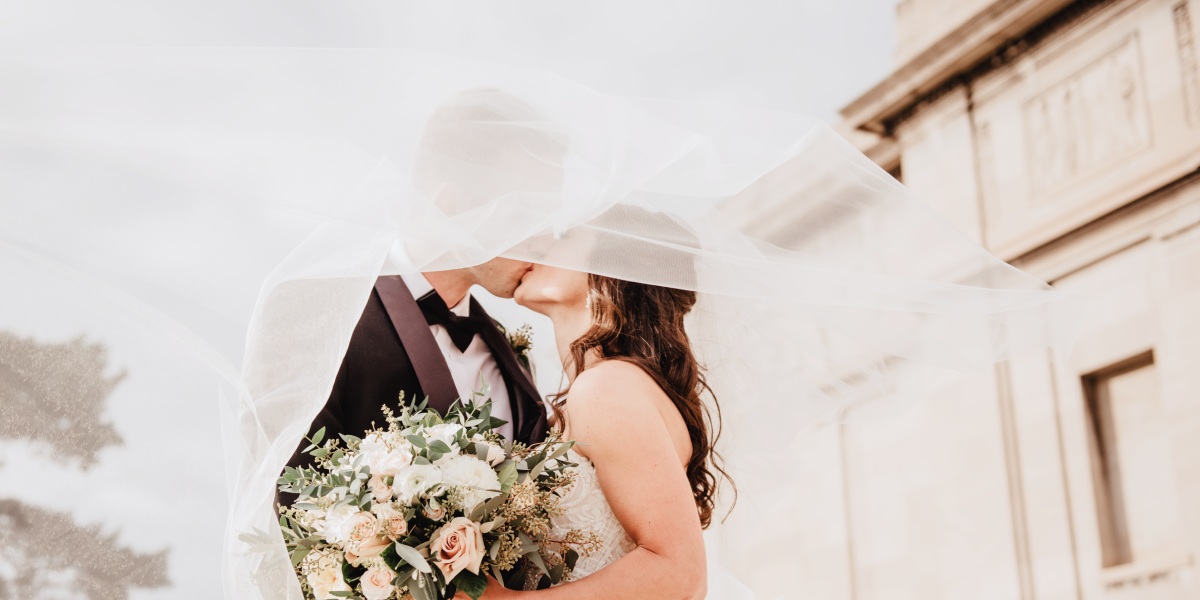 A couple kissing on their wedding day