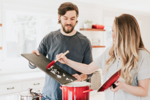 A couple cooking in the kitchen together
